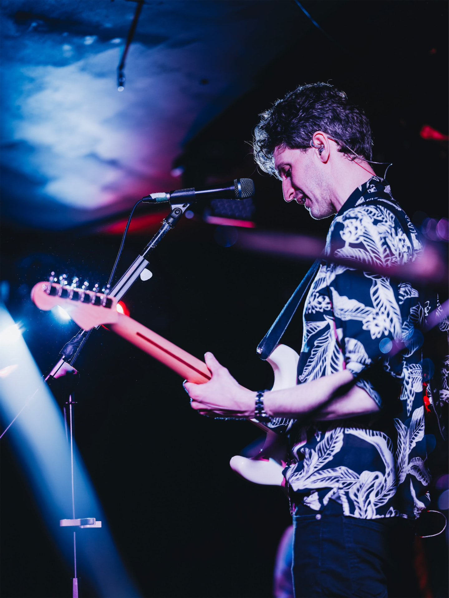 Charles playing guitar at a live show